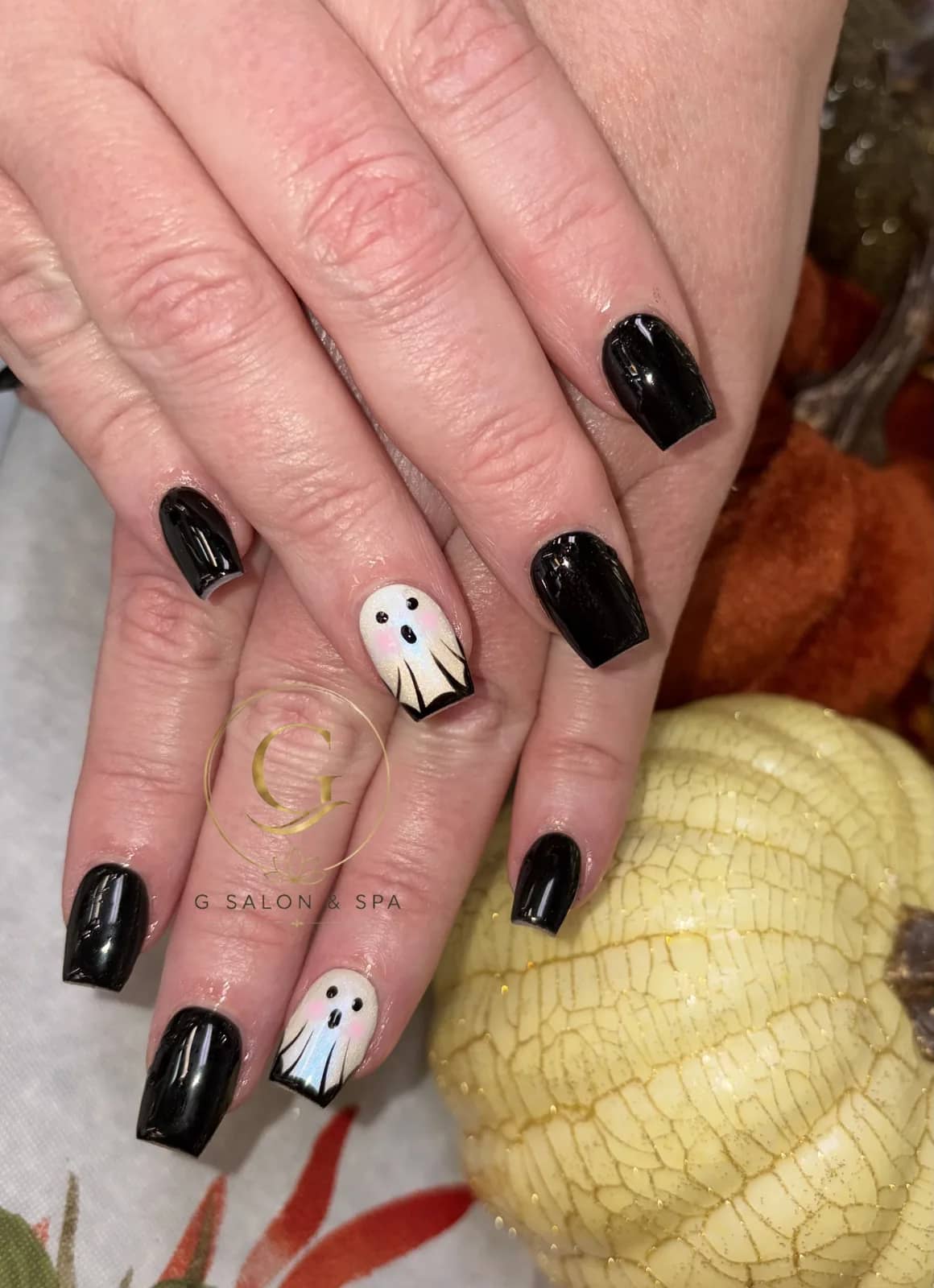 Halloween ghost nail art on glossy black coffin nails at G Salon & Spa in Port St. Lucie, FL