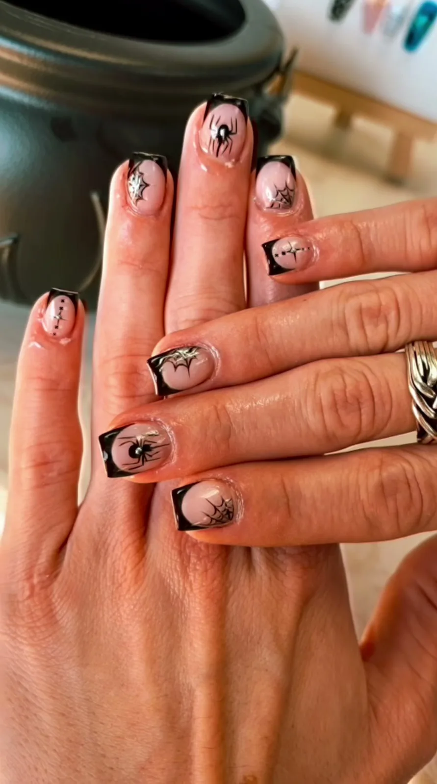 Black V-French nails with spider and spiderweb Halloween nail art at G Salon & Spa in Port St. Lucie, FL