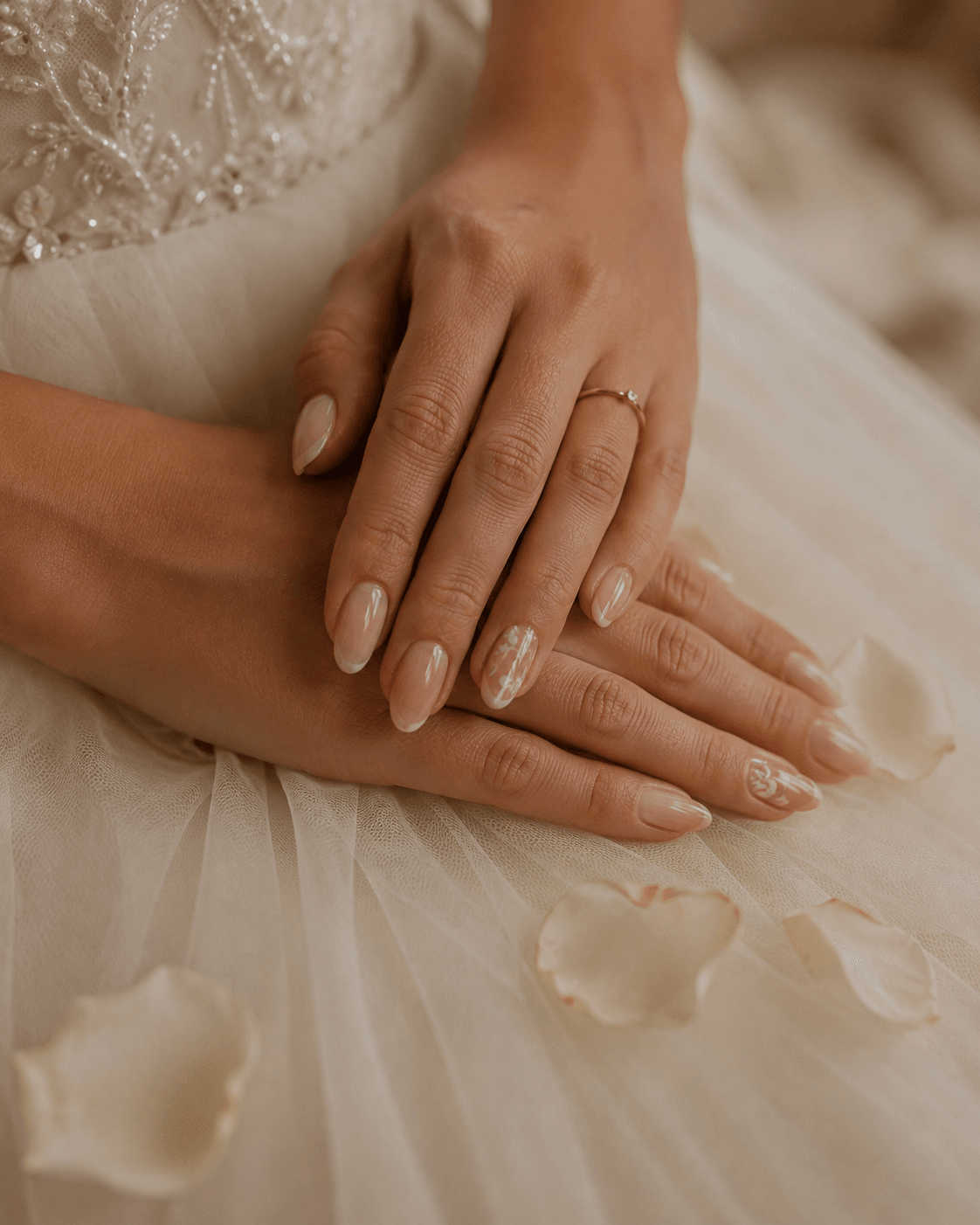 Bridesmaids' hands with delicate floral accent nail art and rose petals at G Salon & Spa in Port St. Lucie, FL