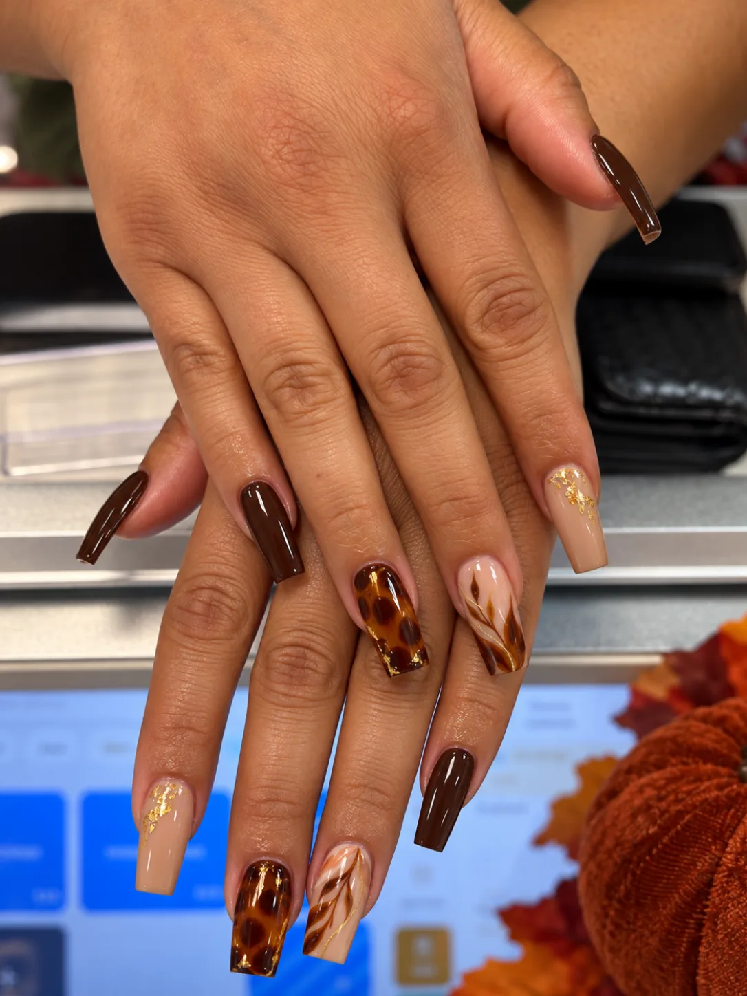 Cocoa brown coffin nails with tortoiseshell and gold accents at G Salon & Spa in Port St. Lucie, FL