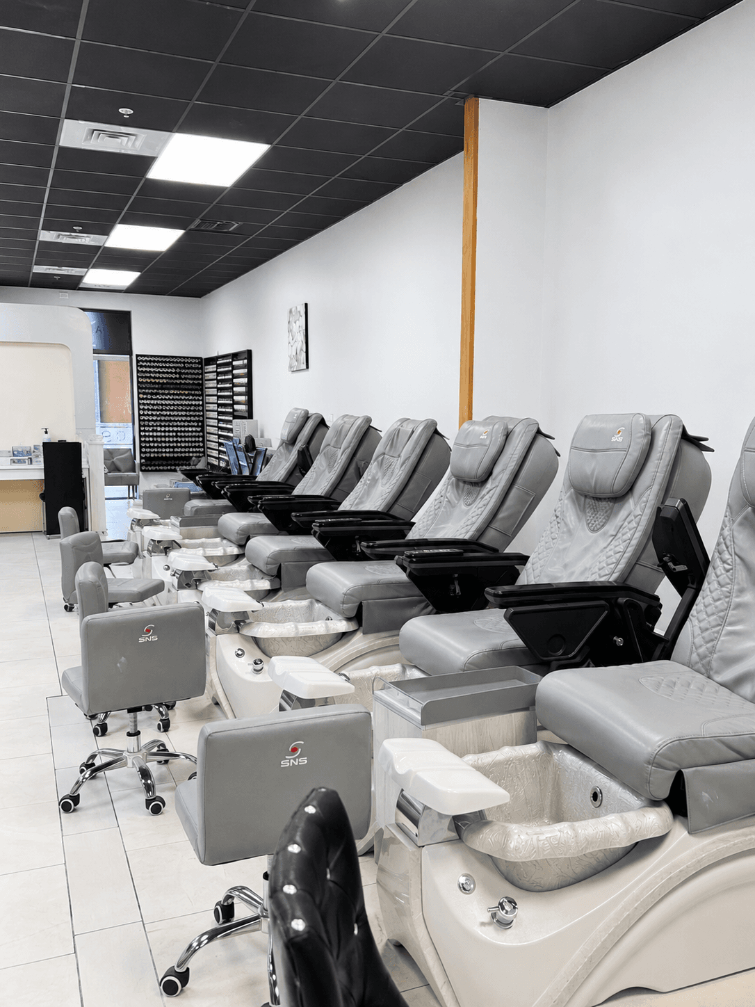 A row of pedicure chairs side by side at G Salon & Spa in Port St. Lucie