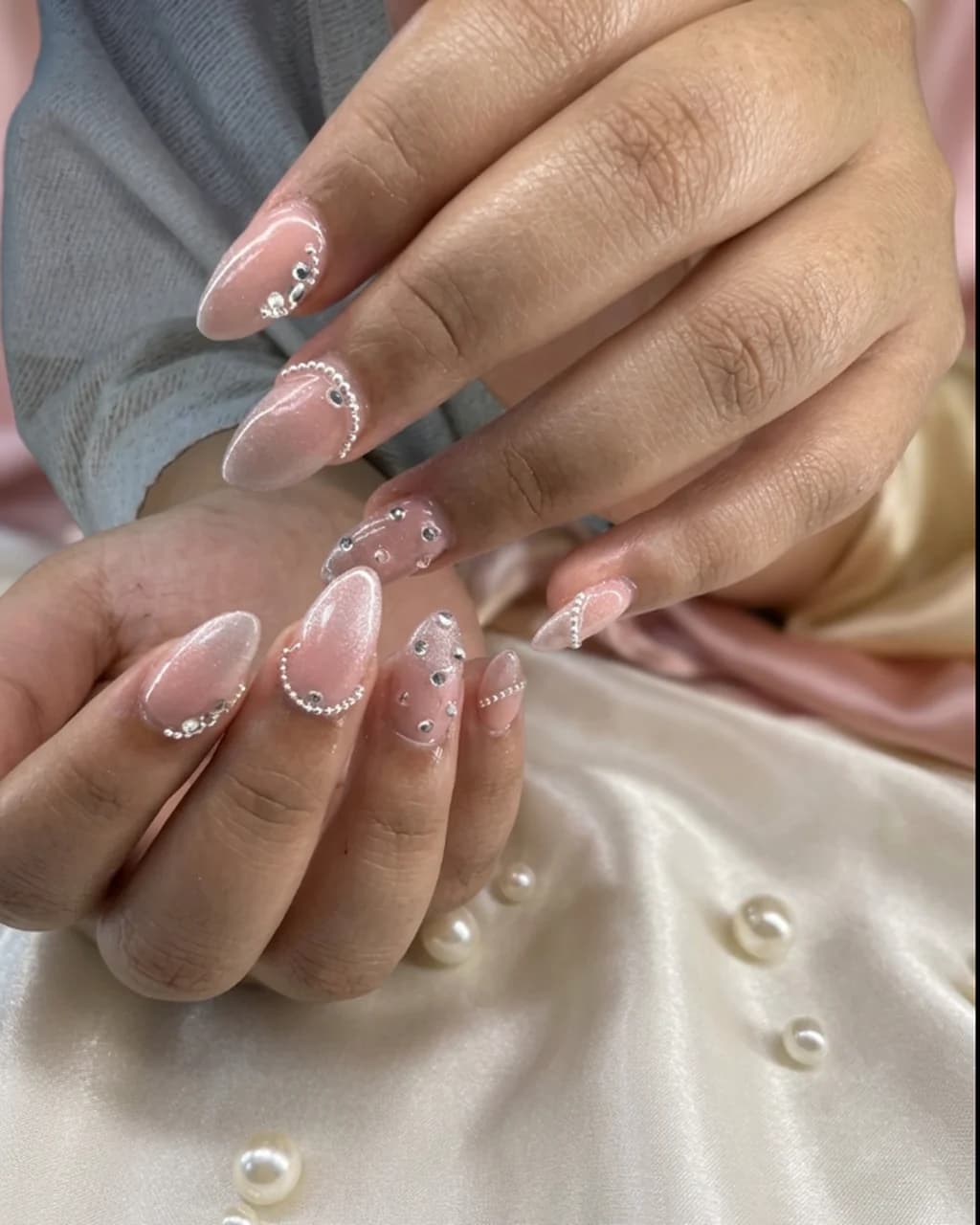 Inspired by a real G Salon set: pink almond nails with a pearl French tip on ivory satin with pearls