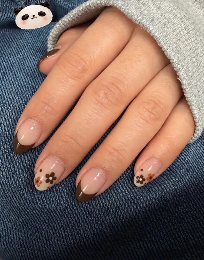 Real set from G Salon & Spa: almond nails with a brown French tip and small painted daisies