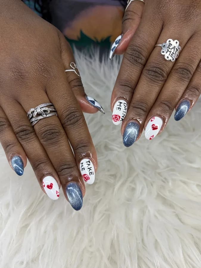 Real set from G Salon & Spa: almond nails with blue cat-eye accents and hand-painted white accent nails