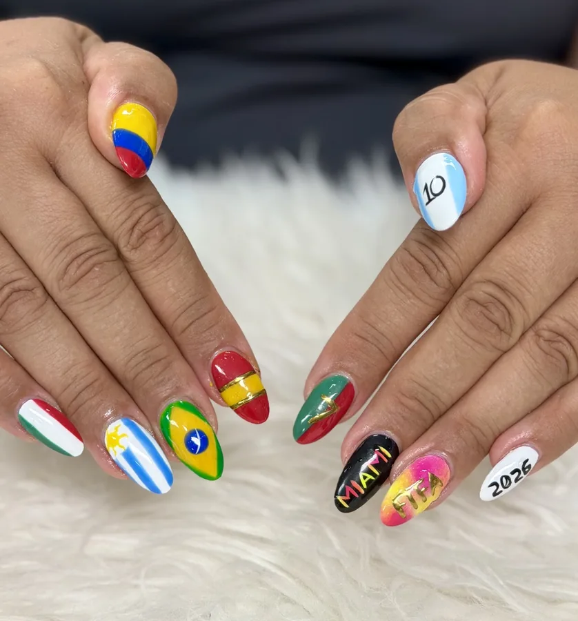Hand-painted soccer flag nail art with a Brazil flag, Miami lettering and a 2026 nail