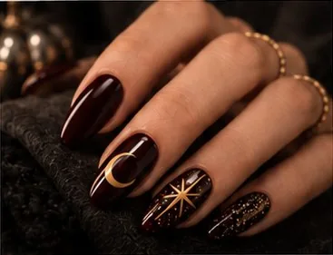 Dark Halloween nail design with gold moon and star
