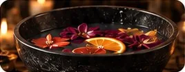 Herbal foot soak with petals and orange